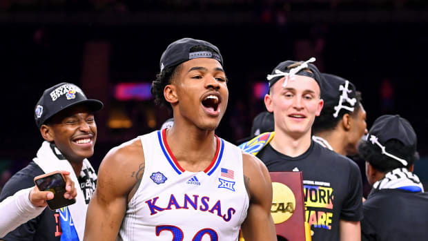 Kansas Jayhawks guard Ochai Agbaji (30) celebrates their win against the North Carolina Tar Heels in the 2022 NCAA men's basketball tournament Final Four championship game at Caesars Superdome.